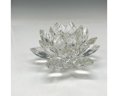 Lovely, multi petaled holder is stunning and crystals reflect and shine under light. Swarovski backstamp. 7600 125 000. This 