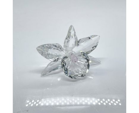 Clear faceted crystal figure of an orchid with a light pink pistil. Swarovski mark. Part of the Exquisite Accents collection.