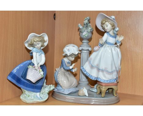 A LLADRO FIGURE GROUP AND A LLADRO FIGURE, comprising A Stitch In Time, no.5344, sculpted by Regino Torrijos, issued 1986-199