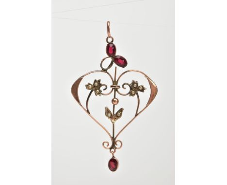 AN AF EDWARDIAN GARNET AND SEED PEARL PENDANT, of an openwork heart design, set with oval cut garnets (one is loose from the 