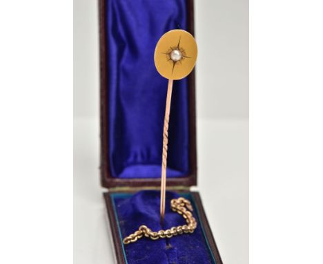 A YELLOW METAL STICK PIN AND PART CHAIN, a plain polished oval set with a cultured star set pearl, unmarked, together with a 