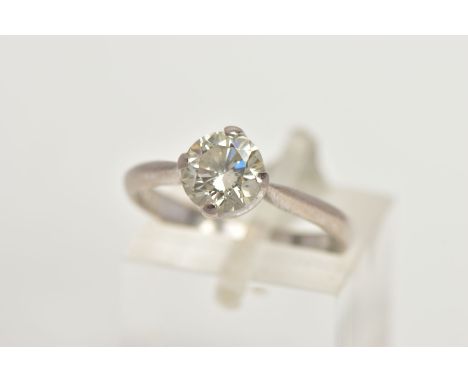 AN 18CT GOLD DIAMOND SOLITAIRE RING, a round brilliant cut diamond in a four prong white gold setting, pinched shoulders lead