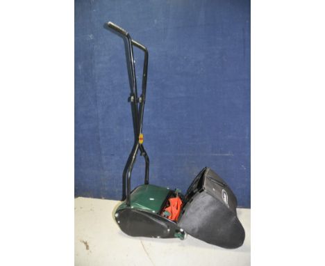 A MODERN WEBB PUSH ALONG MANUAL LAWN MOWER with grass collection bag (looks unused)