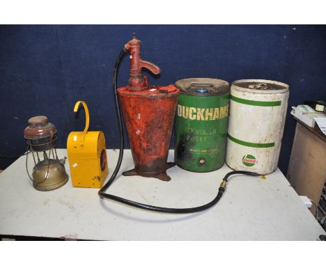A VINTAGE OIL DISPENSER with a Baelz hand pump and badged Shell, a vintage Duckhams 5 Gallon oil drum (with some oil), a Vint