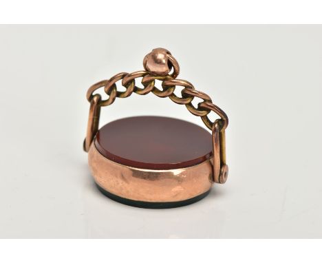 A LATE 19TH CENTURY 9CT GOLD SWIVEL FOB, of a circular form set with bloodstone and carnelian panels, within a plain polished