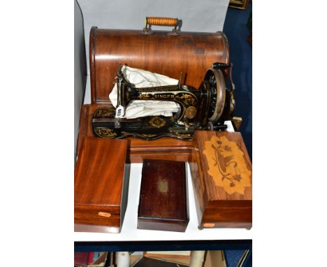 A LATE VICTORIAN SINGER SEWING MACHINE, complete with wooden case, together with drawing instruments in a rosewood box, mahog