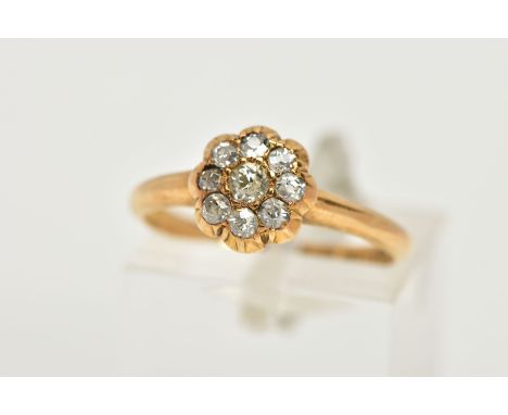 A YELLOW METAL DIAMOND FLOWER RING, flower design set with old cut diamonds, estimated total diamond weight 0.30cts, plain po