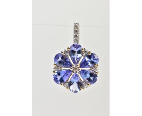 A YELLOW METAL TANZANITE AND SPINEL FLOWER PENDANT, set with six pear cut tanzanite's with colourless spinel detailing, the b