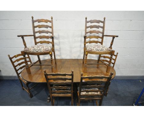 A REPRODUCTION OAK EXTENDING DINING TABLE, with one fold out leaf,  open length 199cm x closed length 155cm x depth 97cm x he