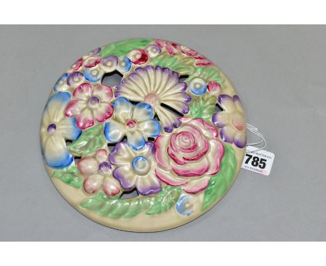 A CLARICE CLIFF WILKINSON LTD CIRCULAR BOUQUET WALL PLAQUE, relief moulded with pastel colour flowers and pierced decoration 