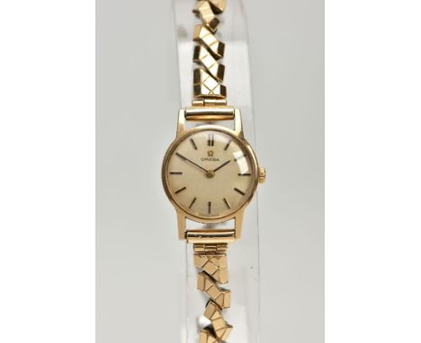 A LADIES 9CT GOLD 'OMEGA' WRISTWATCH, round gold dial signed 'Omega', baton markers, black hands, within a plain polished cas