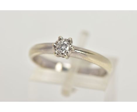 A 9CT WHITE GOLD SINGLE STONE DIAMOND RING, six claw set round brilliant cut diamond, stamped diamond weight 0.10cts, plain p