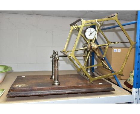 A VICTORIAN BRASS YARN WINDER, the enamel recording gauge dial inscribed John Nesbit, 42 Market Street, Manchester , mounted 