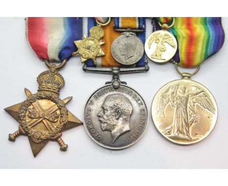 WWI medal pair and star with miniatures  to Captain F J Ewart RFA. Only Star engraved RFA both other medals have name only wi