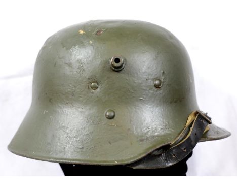 German Imperial WWI style M16 stalhelm helmet with liner, with some dents to crown. P&amp;P Group 2 (£18+VAT for the first lo