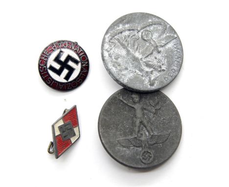Four German WWII type lapel pin badges. P&amp;P Group 1 (£14+VAT for the first lot and £1+VAT for subsequent lots) 