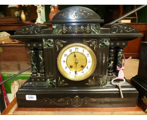 A Victorian marble detailed polished slate mantle clock with key and brass bob-weight pendulum, the brass plate movement havi