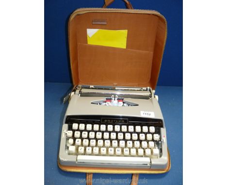 A Brother portable typewriter in brown case.