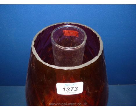 A large church oil heater/lamp on brass base with large glass cranberry shade, diamond pattern,18" tall in total.