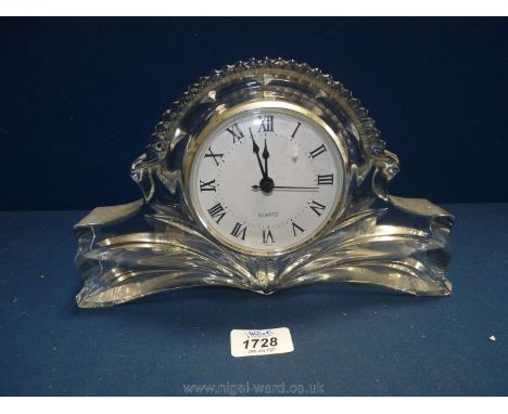A glass quartz battery operated mantle clock, 10 1/2'' x 6 1/2''.