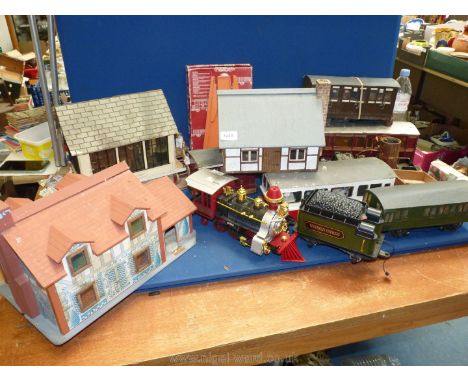 A quantity of large scale garden railway items including coaches, locomotives, buildings, etc, (three boxes)
