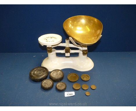 A set of Boots white weighing scales with brass dish, 1lb and oz weights.