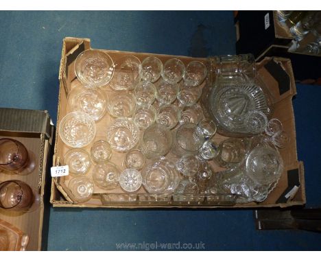 A quantity of glass including champagne bowls, sherry glasses, crescent side dishes, lemon squeezer etc.