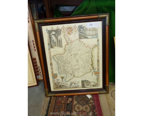 A framed map print of Monmouthshire with three insets of Tintern Abbey, Chepstow Castle etc.