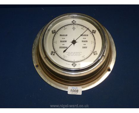 A porthole surround Barometer, 10'' diameter.