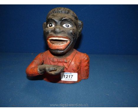 A cast iron  Money Bank.These items are listed on the basis they are illustrative of by a gone culture in which there were di