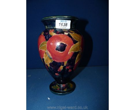 A vintage Moorcroft vase, pomegranate pattern, 1918 to the base, 9" tall. (some repair to base)