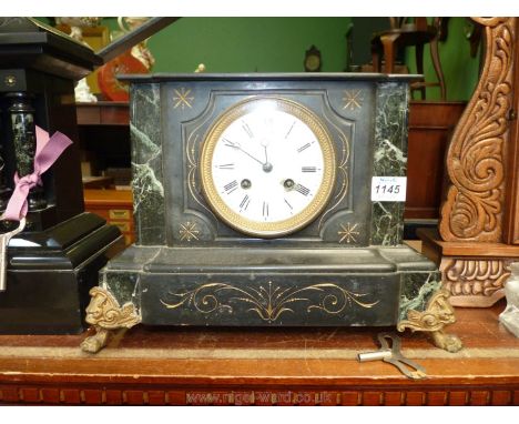 A French black marble Mantle clock, early 1900's, with gilt scroll detail, standing on brass claw feet, white enamel face, Ro