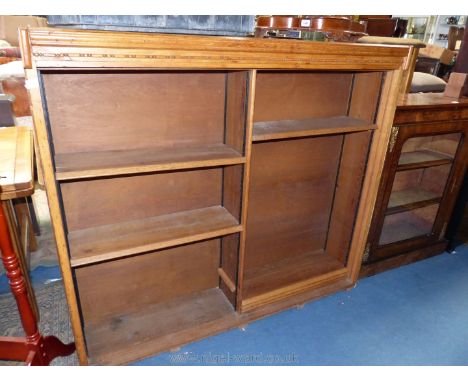 A light Oak finished floor standing bookshelves formerly apparently tambour fronted, 57 5/8'' wide x 12 1/4'' deep x 51 3/8''