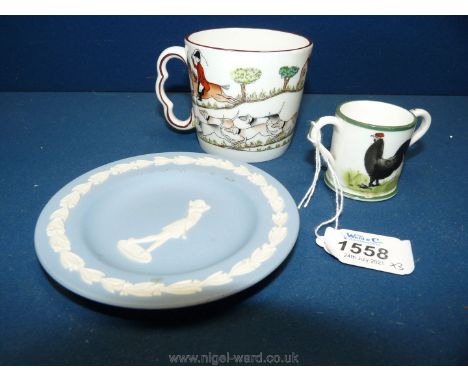 A crown Staffordshire hunting mug, a Wedgwood Jasperware lady golfer pin dish and a miniature mug decorated with a chicken in