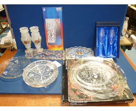 A glass cake stand, footed glass bowl, two boxed Pearl wedding anniversary champagne flutes, Christmas glass plate, boxed and