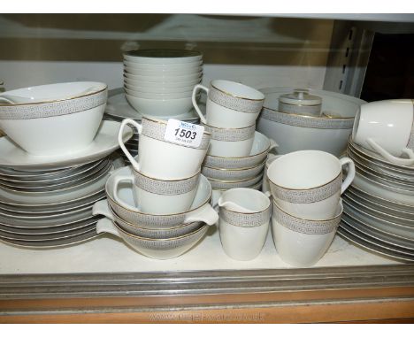A quantity of Schokwald part tea and dinnerware including dinner plates, eight cups and saucers, bowls etc in white with geom