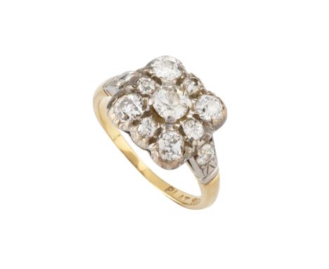 A diamond panel ring, designed as a square cluster of graduated old-cut diamonds, between similarly cut diamond set shoulders