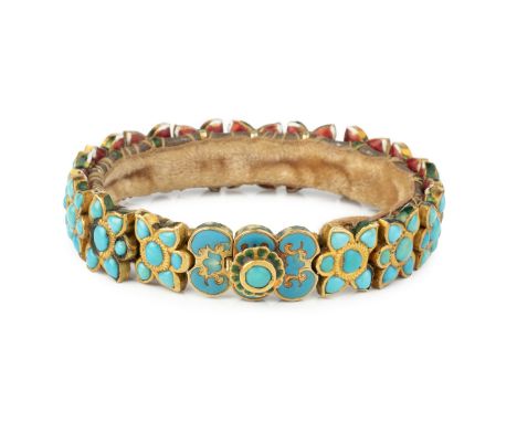 An Indian turquoise and enamel bracelet, composed of repeating turquoise flowerhead panels, edged and backed with enamel deco