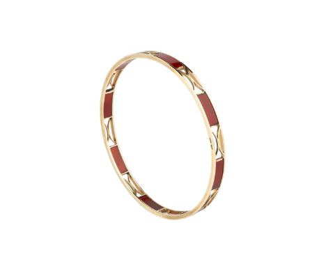 A hardstone set bangle, of openwork design, set with rectangular carnelian panels, stamped '9ct', inner diameter 7.3cmGross w