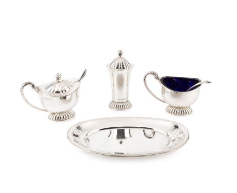 A George VI planished silver three piece cruet set, by Robert Edgar Stone, comprising oval mustard, side handled salt and a p