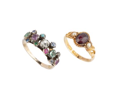 A vari gem set dress ring, the central cushion-shaped diamond flanked by vari-coloured gemstones and stones in pinched collet