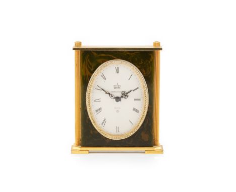 A 'Recital' 8 day alarm and calendar desk clock by Jaeger-Le-Coultre, the oval silvered dial with Roman numerals and calendar