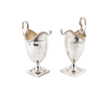 A George III silver pedestal cream jug, with beaded border, reeded strap handle and bright-cut floral swag engraved decoratio
