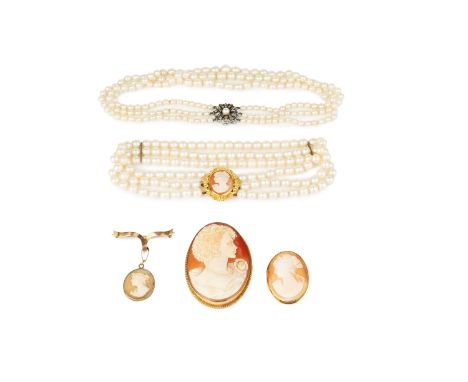 A cultured pearl triple strand necklace, with oval shell cameo clasp, together with another cultured pearl triple strand neck