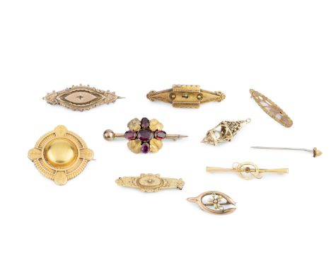 A collection of brooches, comprising a Victorian boss brooch, glazed panel verso, six further Victorian and later bar brooche