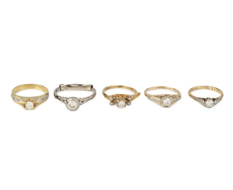 A diamond single stone ring, the round brilliant-cut diamond in raised four claw setting, between diamond set shoulders, 18ct