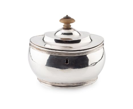 A George III silver tea caddy, of rounded oval form with reeded borders, the hinged cover with boxwood finial by Charles Aldr