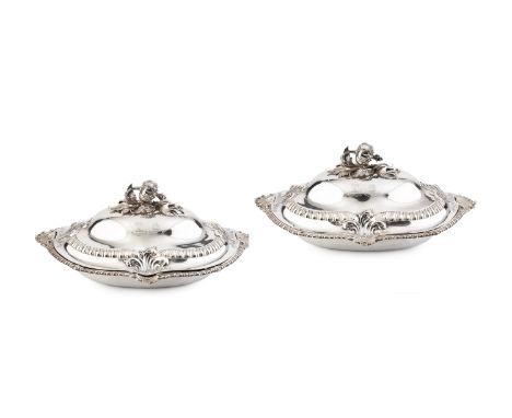 A pair of early Victorian silver entrée dishes and covers, of shaped oval form with foliate embossed and gadrooned decoration