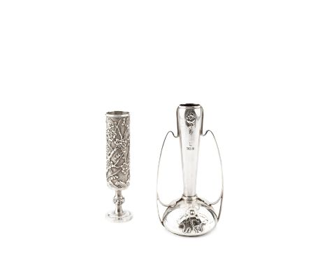 A late 19th/early 20th century Chinese export silver bud vase, the cylindrical body relief decorated with branches of floweri