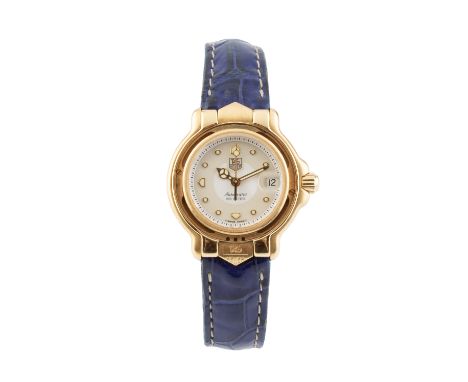 A lady's 18ct gold cased automatic wristwatch by Tag Heuer, the circular two tone cream and white dial with centre seconds ha